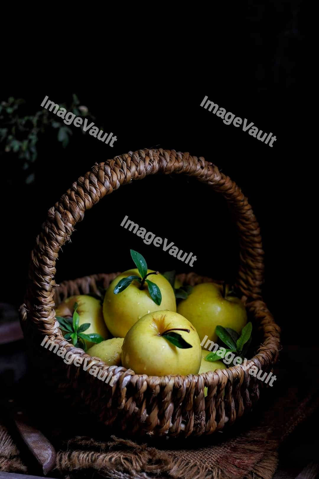 Straw basket with apples